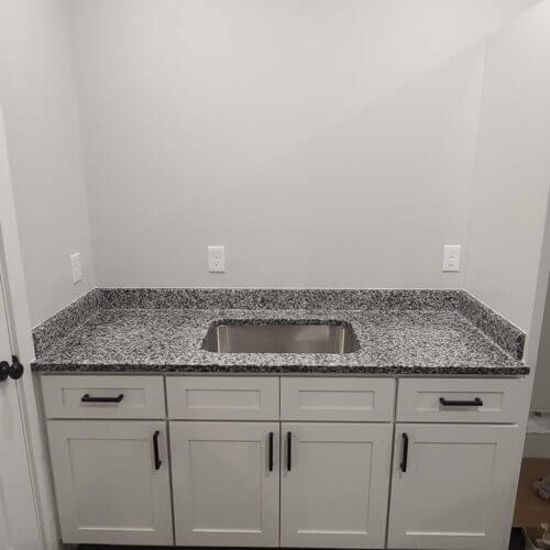 Black And White Counter Top On The Double Bath Room Sink.